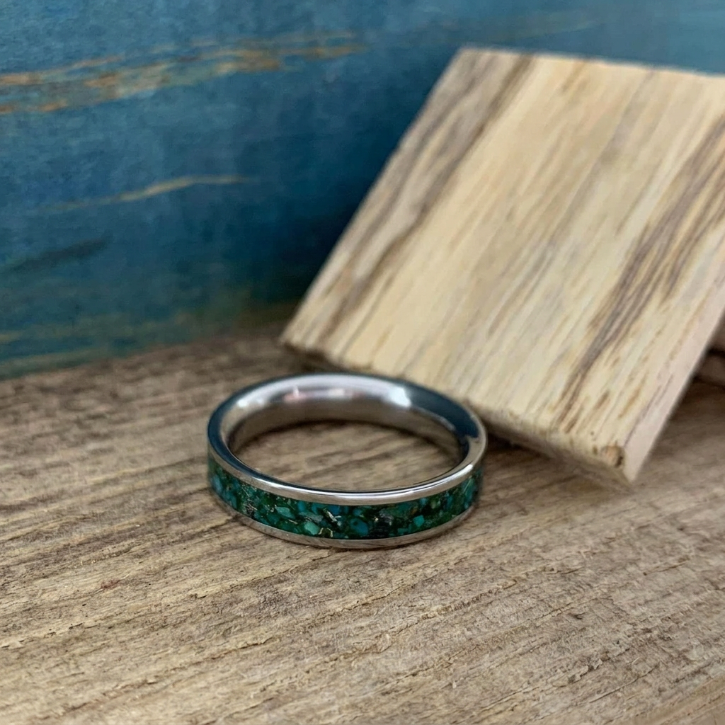 Nature inspired titanium ring featuring chrysocolla, green goldstone and 10k gold flakes