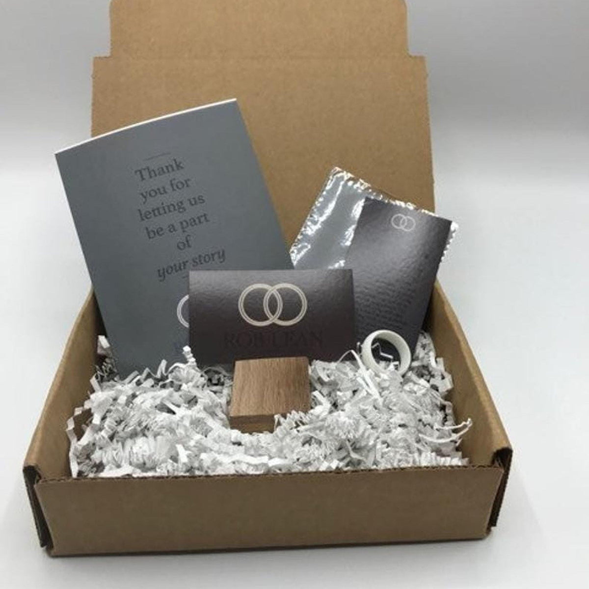 Handmade oak ring keepsake box, care card, and ring sizer packaging included with order