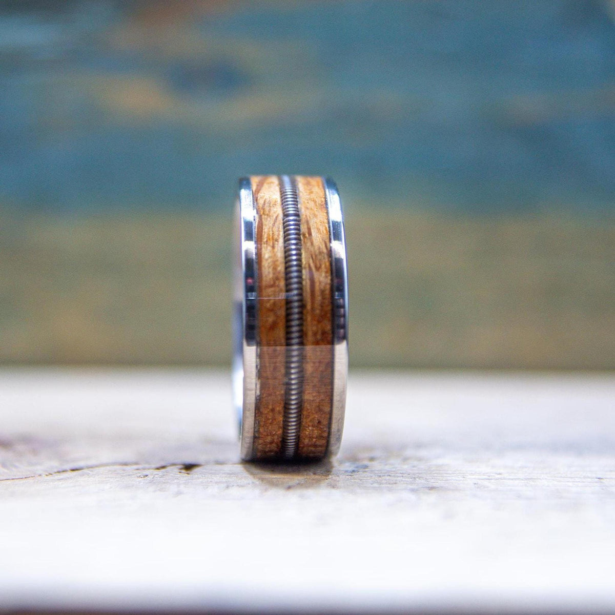 Musician wedding ring with real guitar string and aged whiskey barrel wood