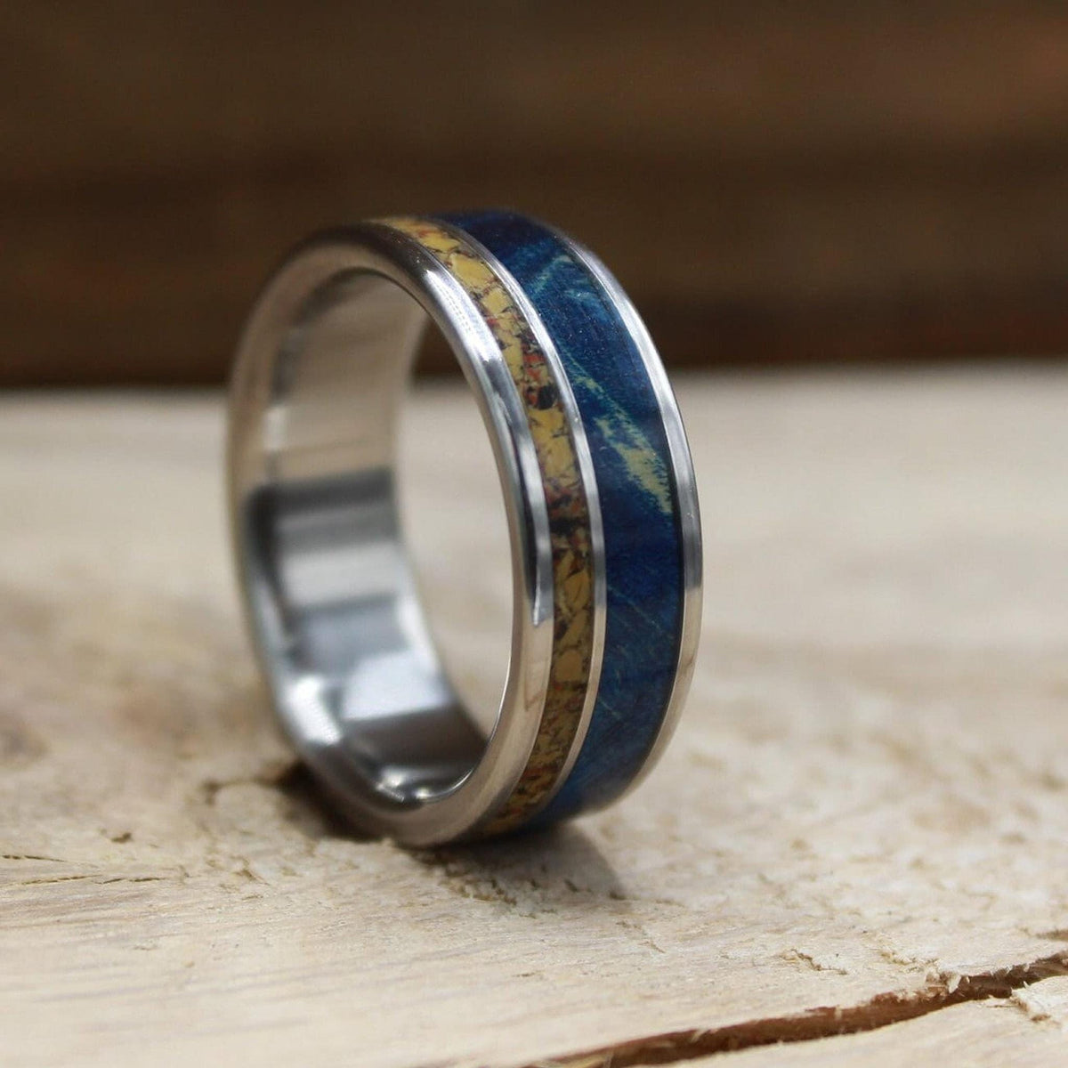 Men's titanium wedding band with dinosaur bone and blue wood. Blue wood ring. Titanium Ring. Dinosaur bone ring.