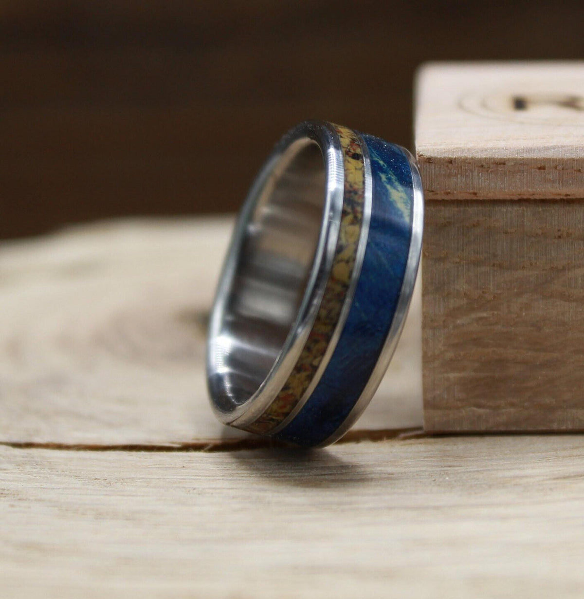 Men's titanium wedding band with dinosaur bone and blue wood. Blue wood ring. Titanium Ring. Dinosaur bone ring.