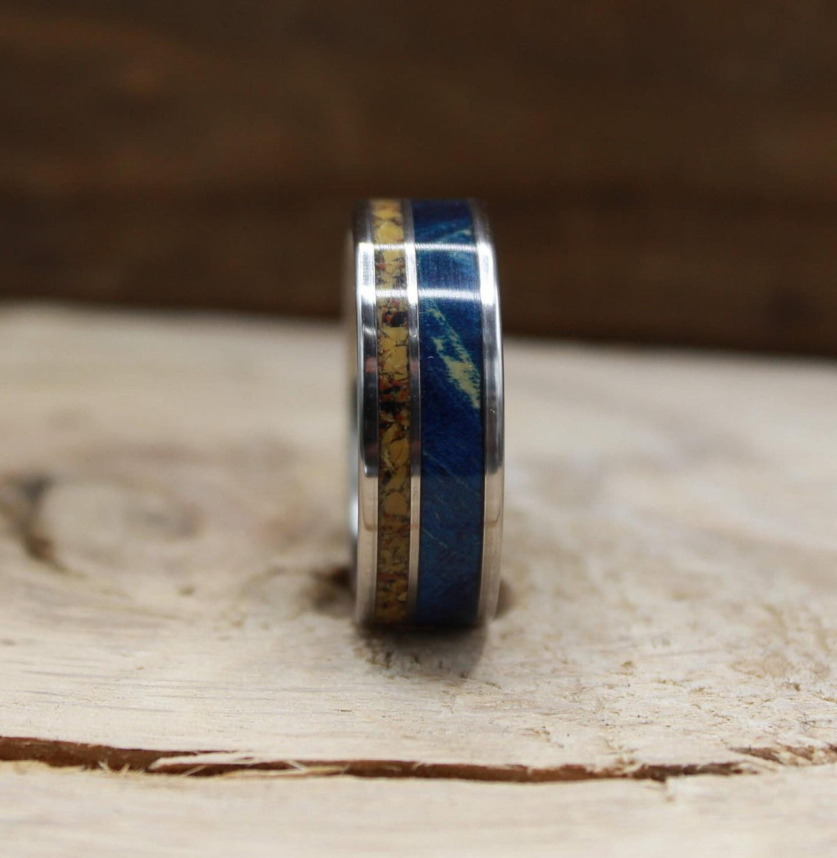 Men's titanium wedding band with dinosaur bone and blue wood. Blue wood ring. Titanium Ring. Dinosaur bone ring.
