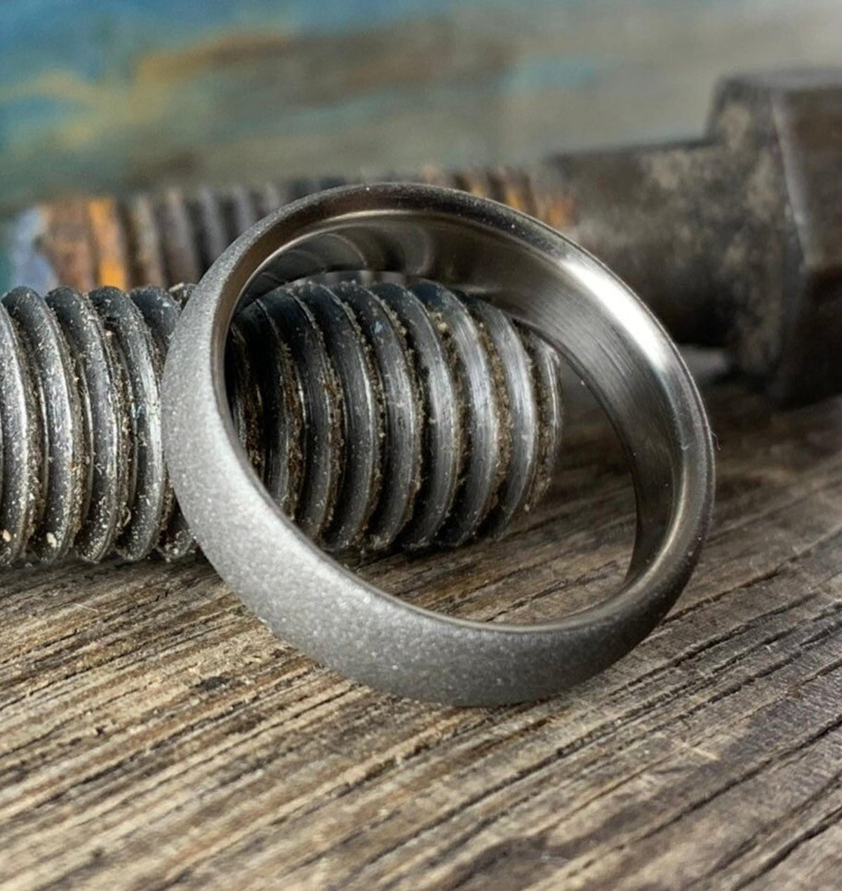 Interior perspective of titanium wedding band showing smooth comfort-fit core