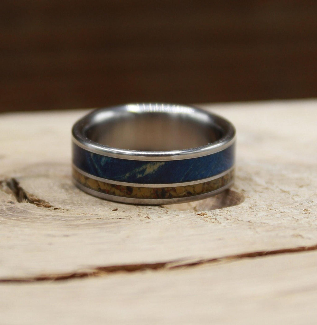 Men's titanium wedding band with dinosaur bone and blue wood. Blue wood ring. Titanium Ring. Dinosaur bone ring.