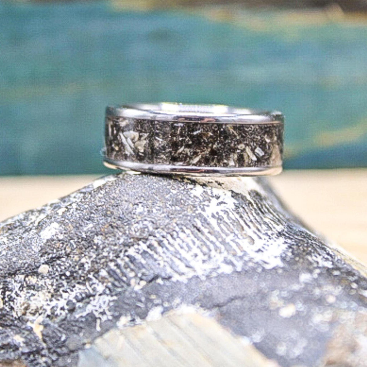 Megalodon tooth titanium ring showing natural texture and variation in fossil material
