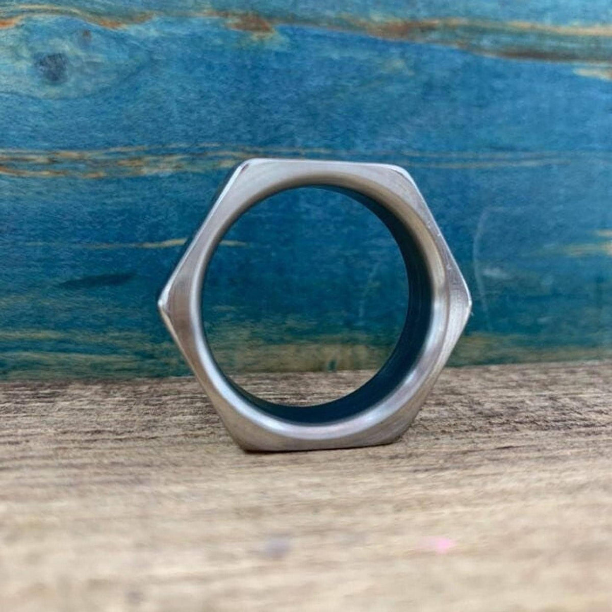 A straight-on view through the center opening of the hexagonal metal band.