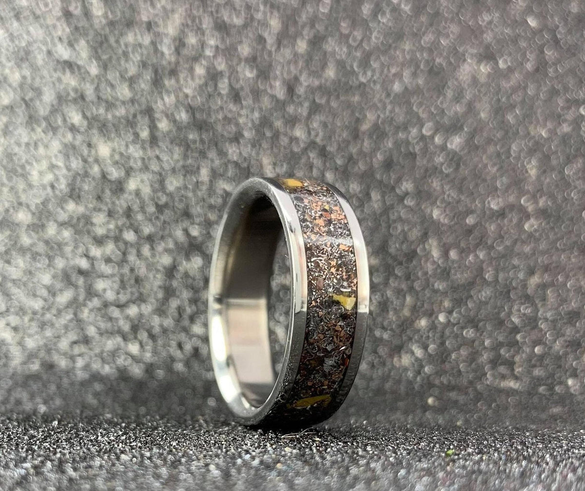 Men's aerospace titanium wedding band with meteorite and dinosaur bone inlay, featuring a sleek 4-5mm men's ring design.