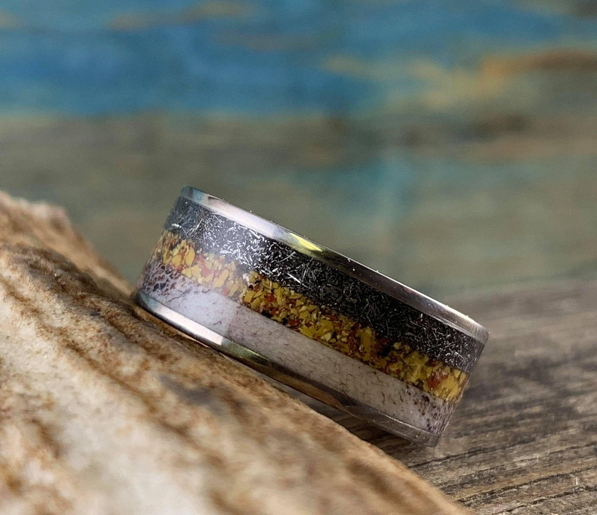 Titanium men's wedding band with meteorite, dinosaur bone, and deer antler inlay, crafted by RobandLean's rings.