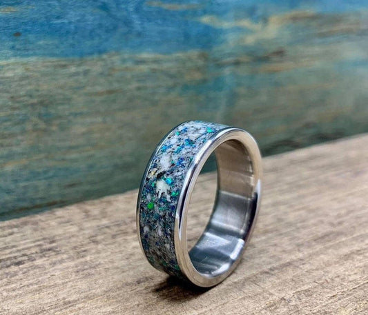 Men's titanium wedding band with engraved granite and opal inlay, stylish engagement ring by RobandLean's rings.