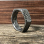 Damascus steel wedding band with hexagon cut design from RobandLean's Rings, featuring a comfort fit and stainless steel construction.