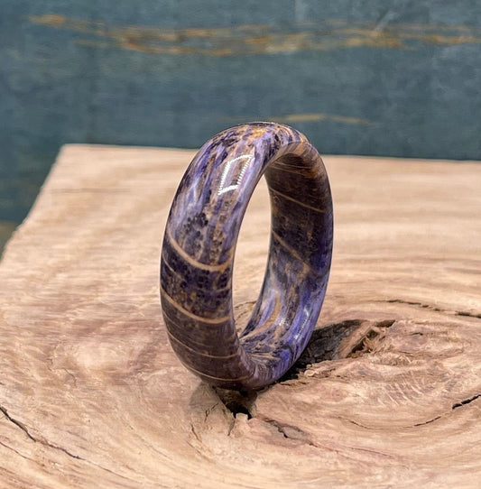 Custom oak wood men's wedding band with purple accents from RobandLean's Rings, showcasing a polished, handcrafted design.