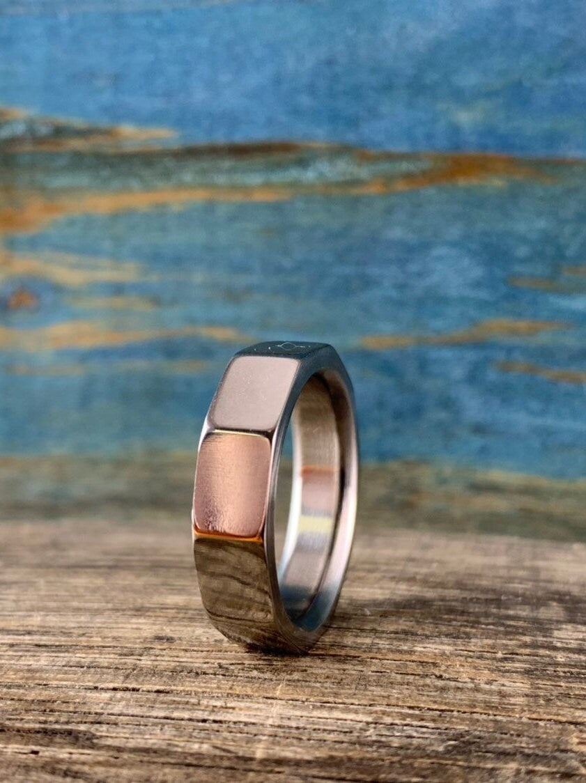 Men's Decagon Titanium wedding band with ten-sided geometric design, crafted by RobandLean's rings.