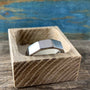 Men's titanium Decagon wedding band with a ten-sided geometric design, featuring a sleek, modern style from RobandLean's rings.