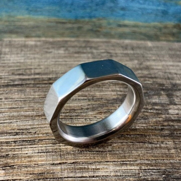 Men's Decagon Titanium Wedding Band with ten-sided geometric design, featuring a sleek, modern style from RobandLean's rings.