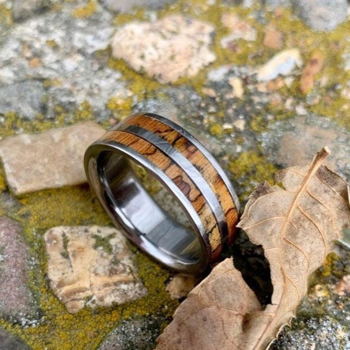 Men's titanium wedding band with pecan wood inlay, western-inspired design from RobandLean's rings.