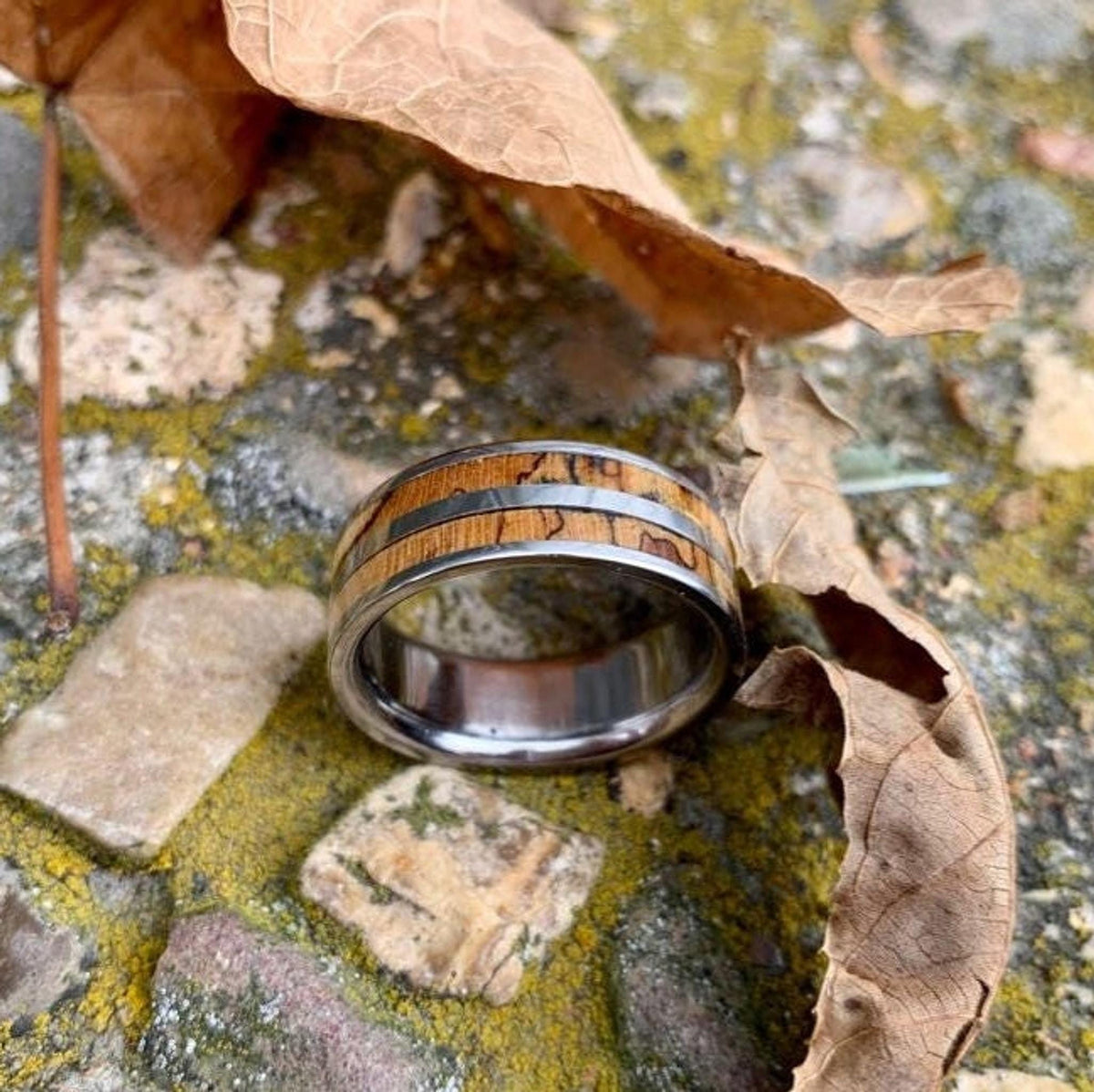 Men's titanium wedding band with pecan wood inlay, western-inspired design by RobandLean's rings.