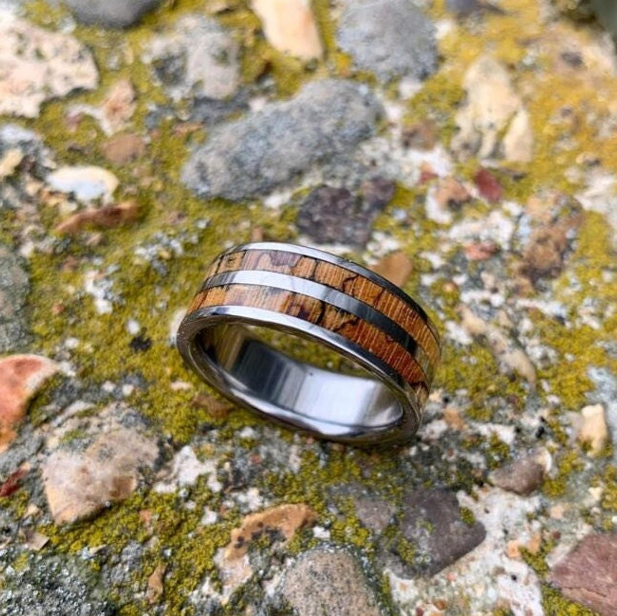 Men's titanium wedding band with pecan wood inlay, western-inspired design from RobandLean's rings.