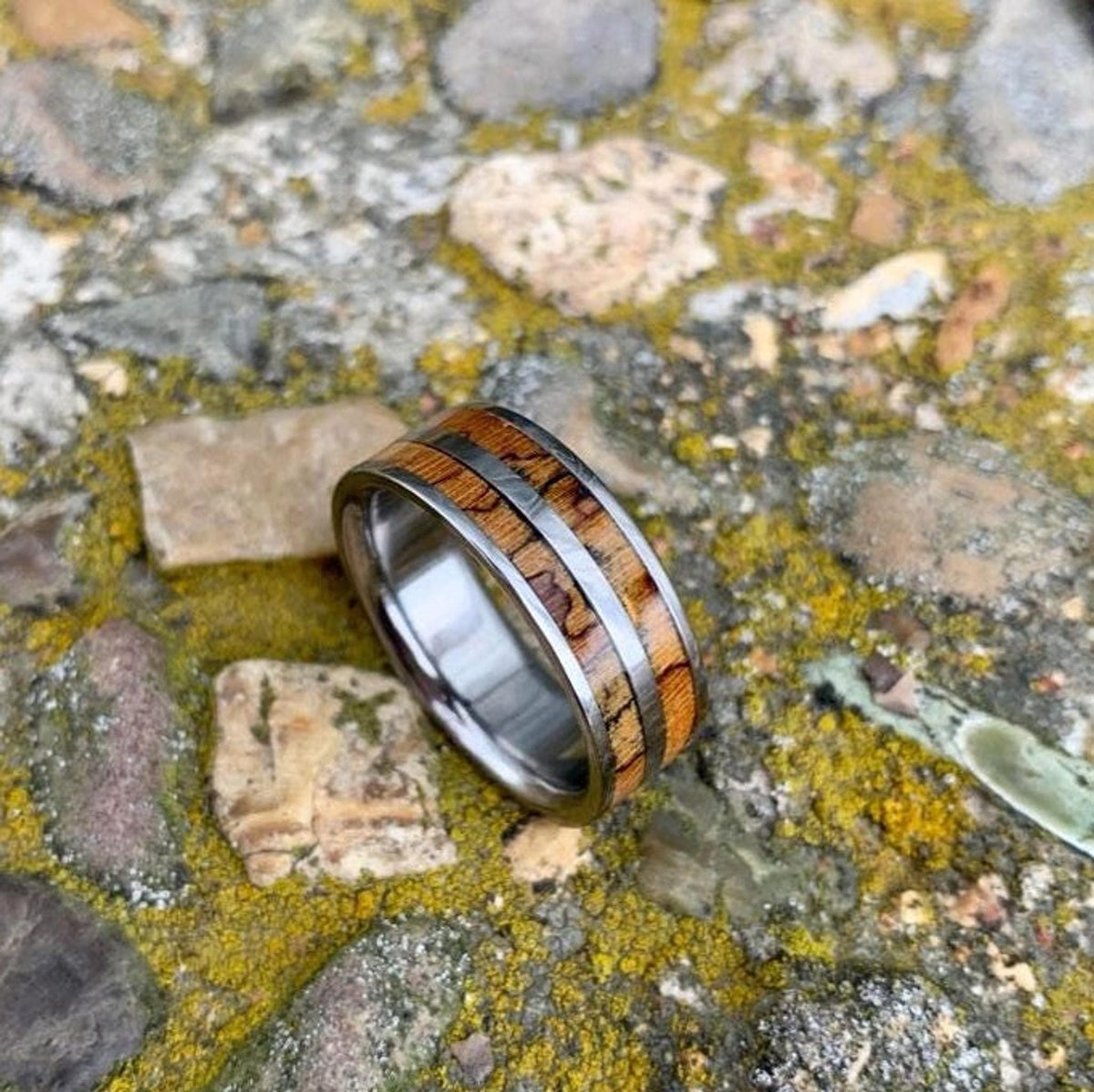 Men's titanium wedding band with pecan wood inlay, western-inspired design, from RobandLean's rings collection.