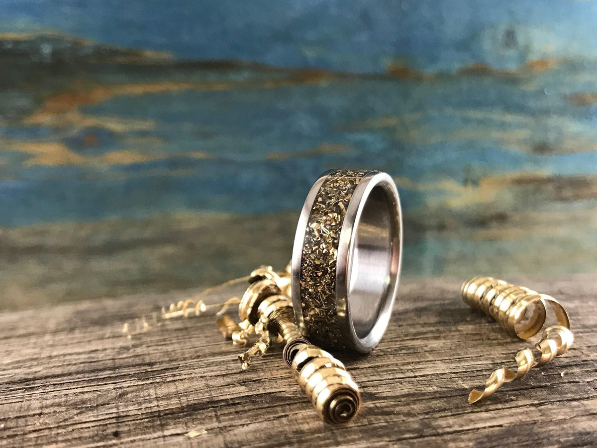 Men's recycled gold titanium wedding band from RobandLean's rings, featuring a 3.5mm eco-friendly design with a sleek finish.
