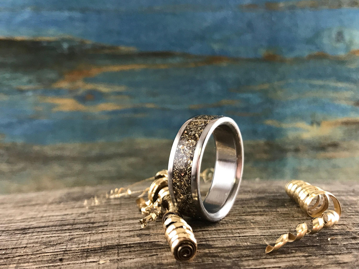 Recycled gold men's titanium wedding band from RobandLean's rings, eco-friendly and 3.5mm wide with a sleek, polished finish.