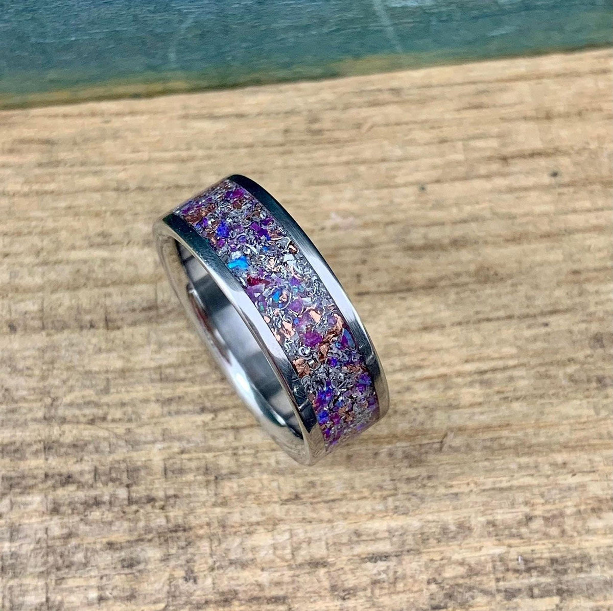 Men's titanium wedding band with meteorite inlay, purple opal, amethyst, and sugilite accents from RobandLean's rings.