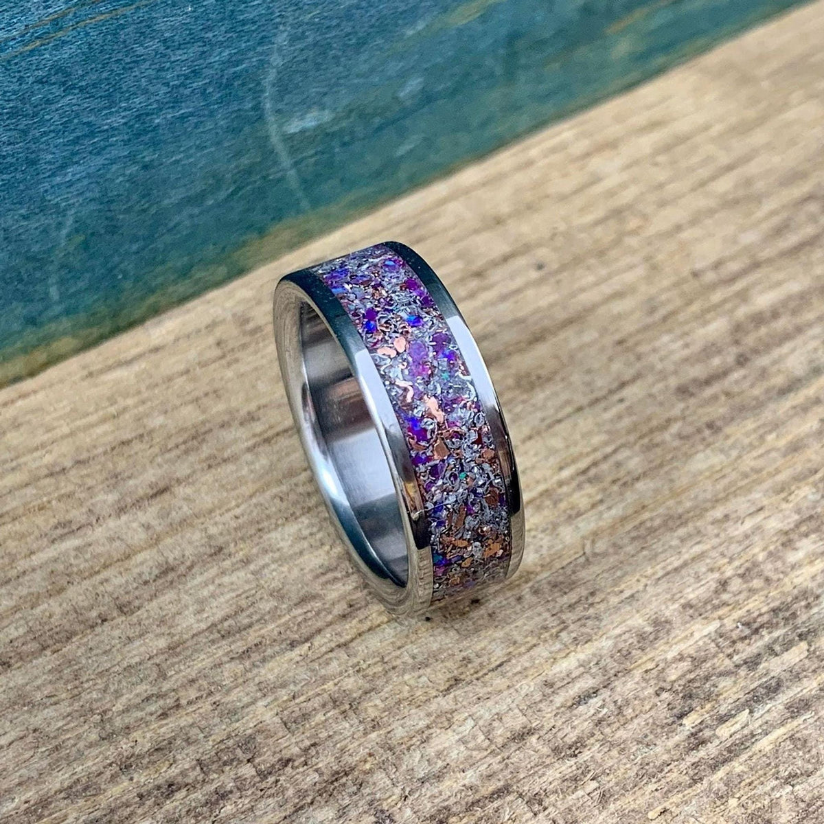 Men's titanium wedding band with meteorite inlay, purple opal, amethyst, and sugilite, crafted by RobandLean's rings.