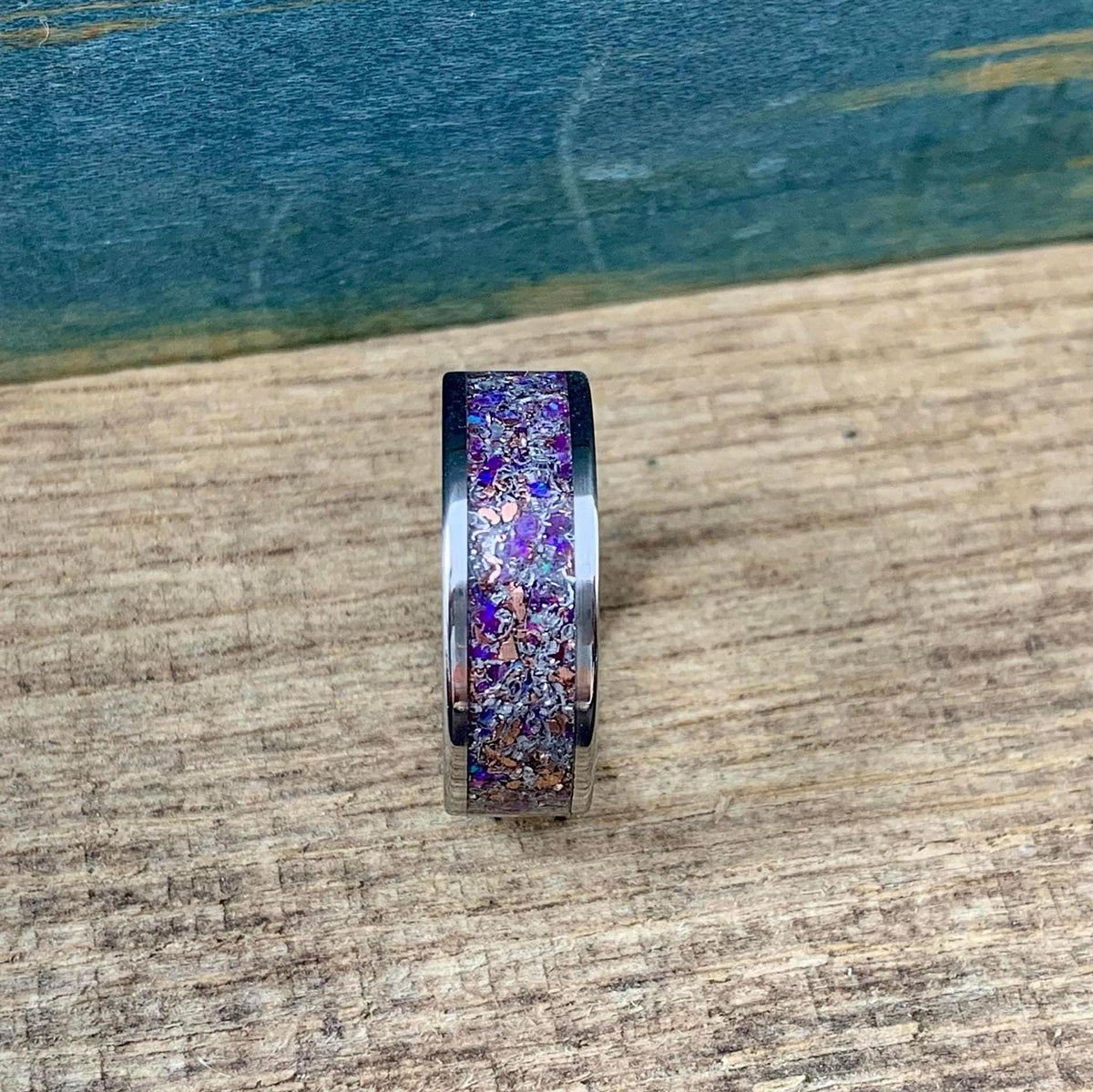 Men's titanium meteorite wedding band with purple opal, amethyst, and sugilite accents, crafted by RobandLean's rings.