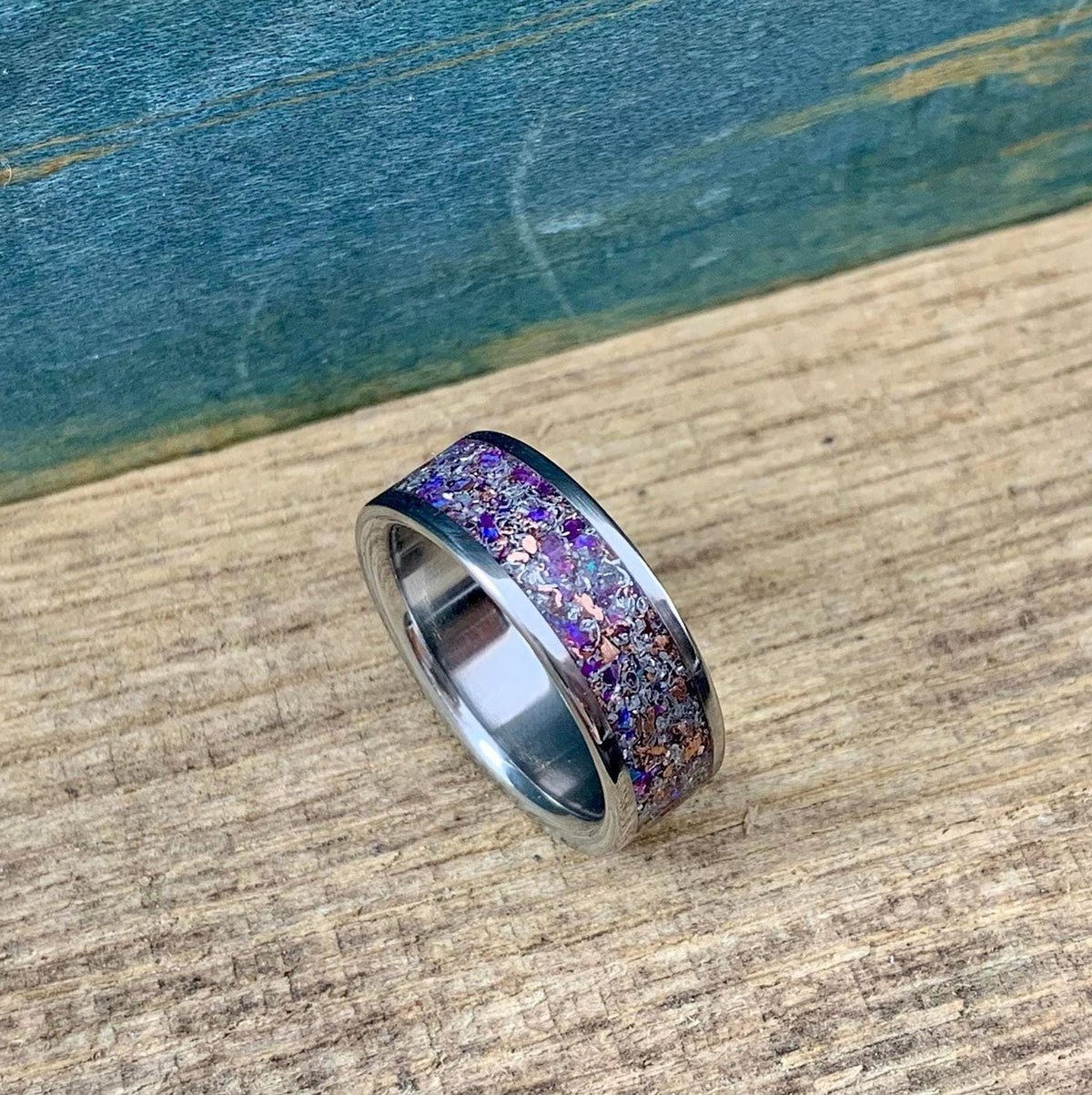 Mens titanium wedding band with meteorite inlay, featuring purple opal, amethyst, and sugilite accents, from RobandLean's rings.