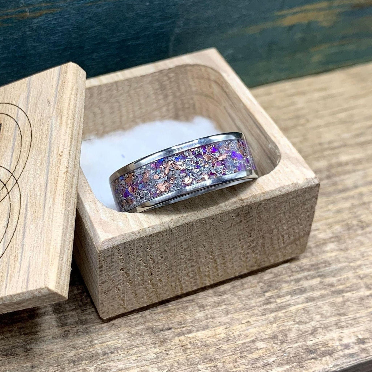 Men's titanium Meteorite wedding band with purple opal, amethyst, and sugilite accents from RobandLean's Rings.