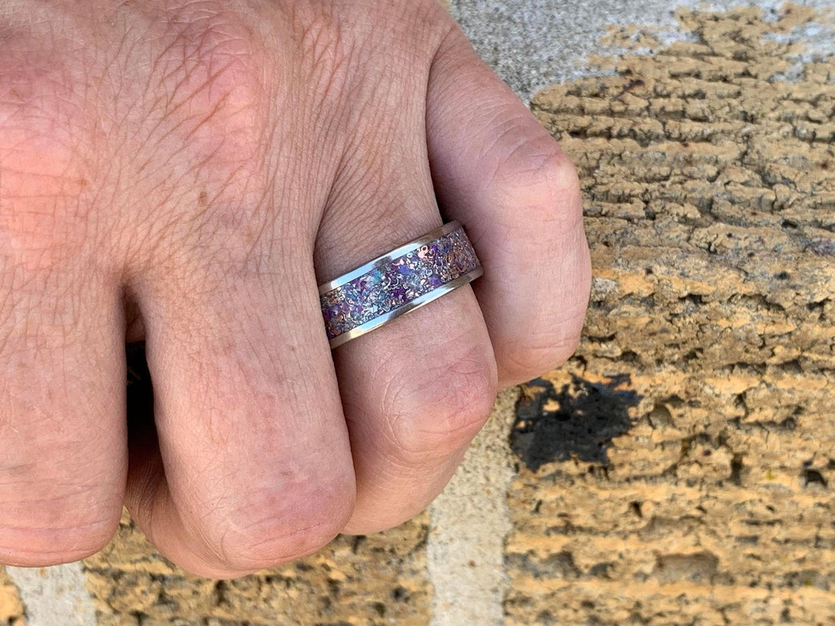 Men's meteorite wedding band by RobandLean's Rings, titanium with purple opal, amethyst, and sugilite in a sleek design.