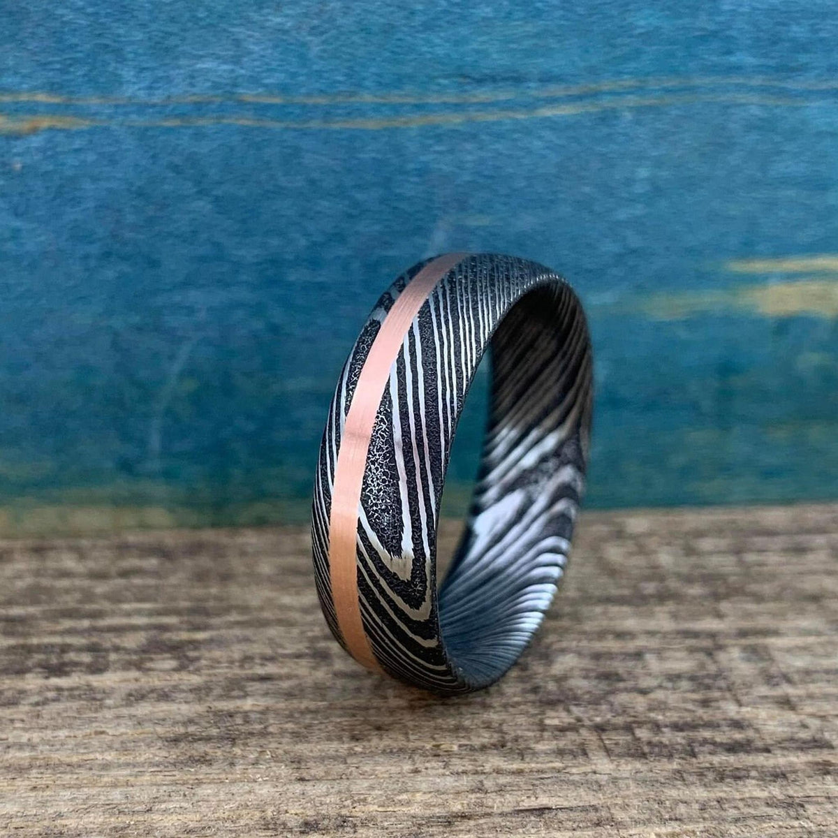 Damascus steel and copper men's wedding band with intricate inlay, stainless steel RobandLean's rings wedding band.