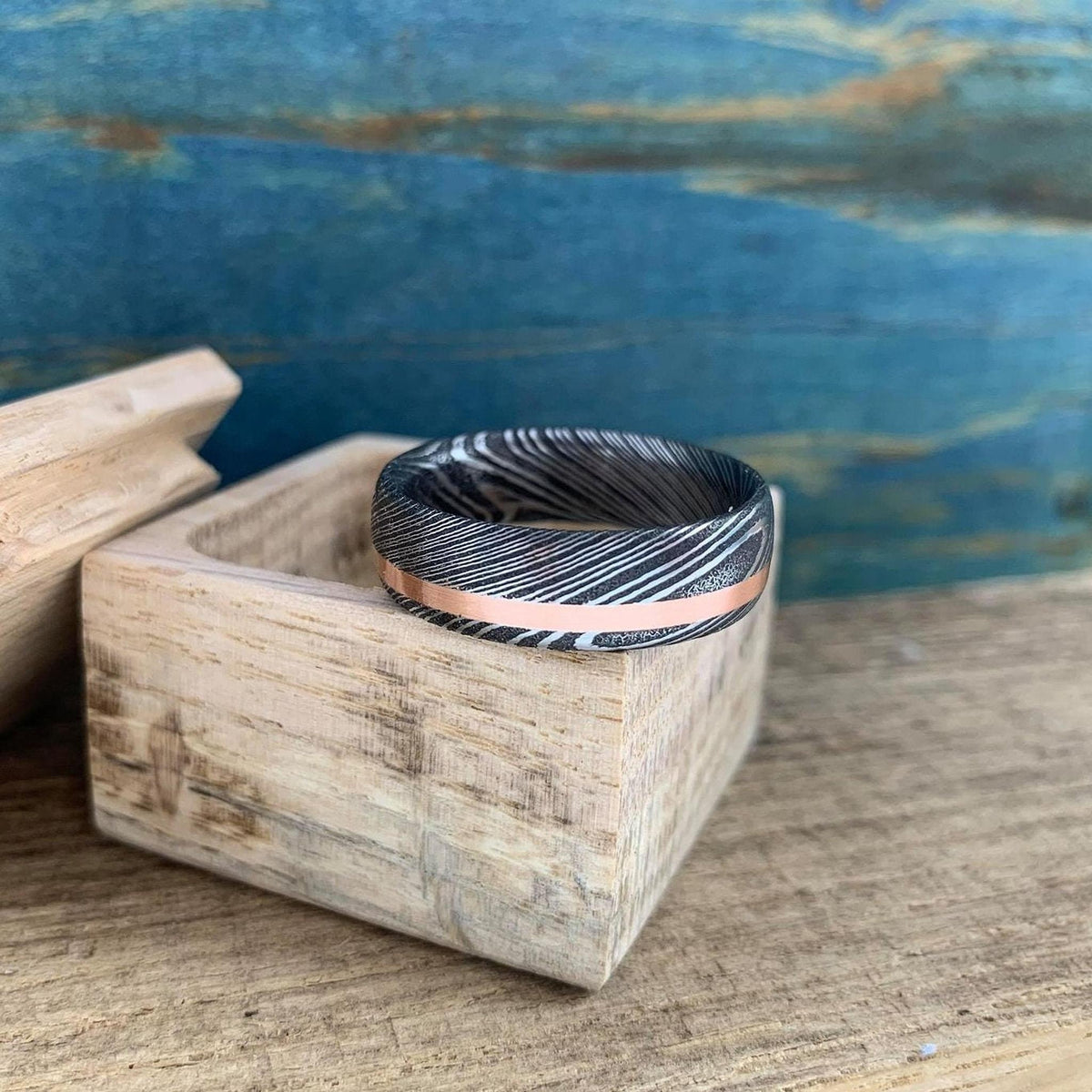 Damascus steel and copper men's wedding band with inlay, stainless steel RobandLean's rings wedding band design.