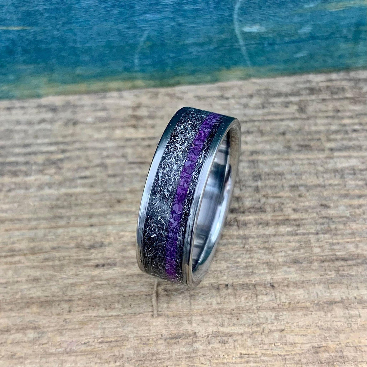 Mens titanium wedding band with Gibeon meteorite and purple Sugilite, featuring a sleek 4.5mm design from RobandLean's rings collection.