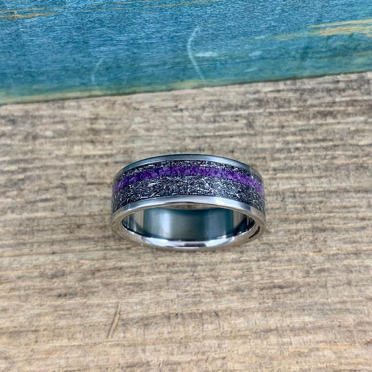 Mens titanium wedding band with Gibeon meteorite and purple Sugilite, featuring a sleek design and comfort fit from RobandLean's rings.