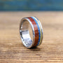 Titanium men's wedding band with Amboyna Burl wood and turquoise inlay, crafted by RobandLean's rings.
