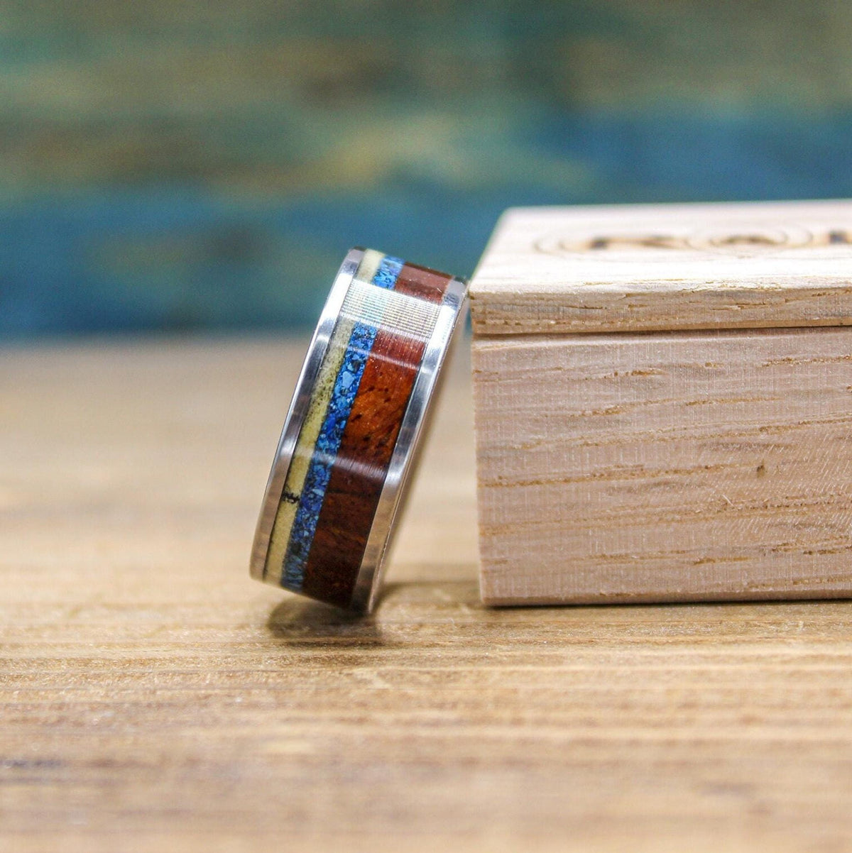 Titanium men's wedding band by RobandLean's rings with Amboyna burl wood and turquoise inlay, size 5.5mm, stylish and durable design.
