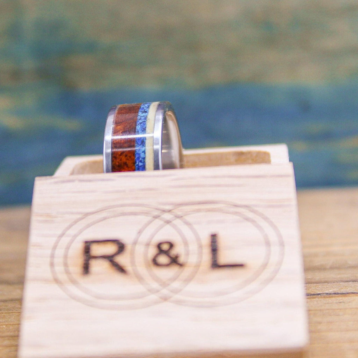 Titanium men's wedding band with Amboyna burl wood and turquoise inlay, RobandLean's rings, size 5.5mm, stylish and durable design.