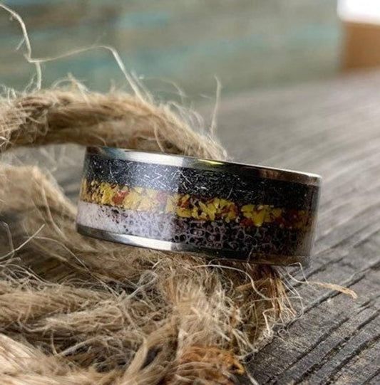 Men's titanium wedding band with deer antler, meteorite, and dinosaur bone accents, featuring a 6.5mm wide design.