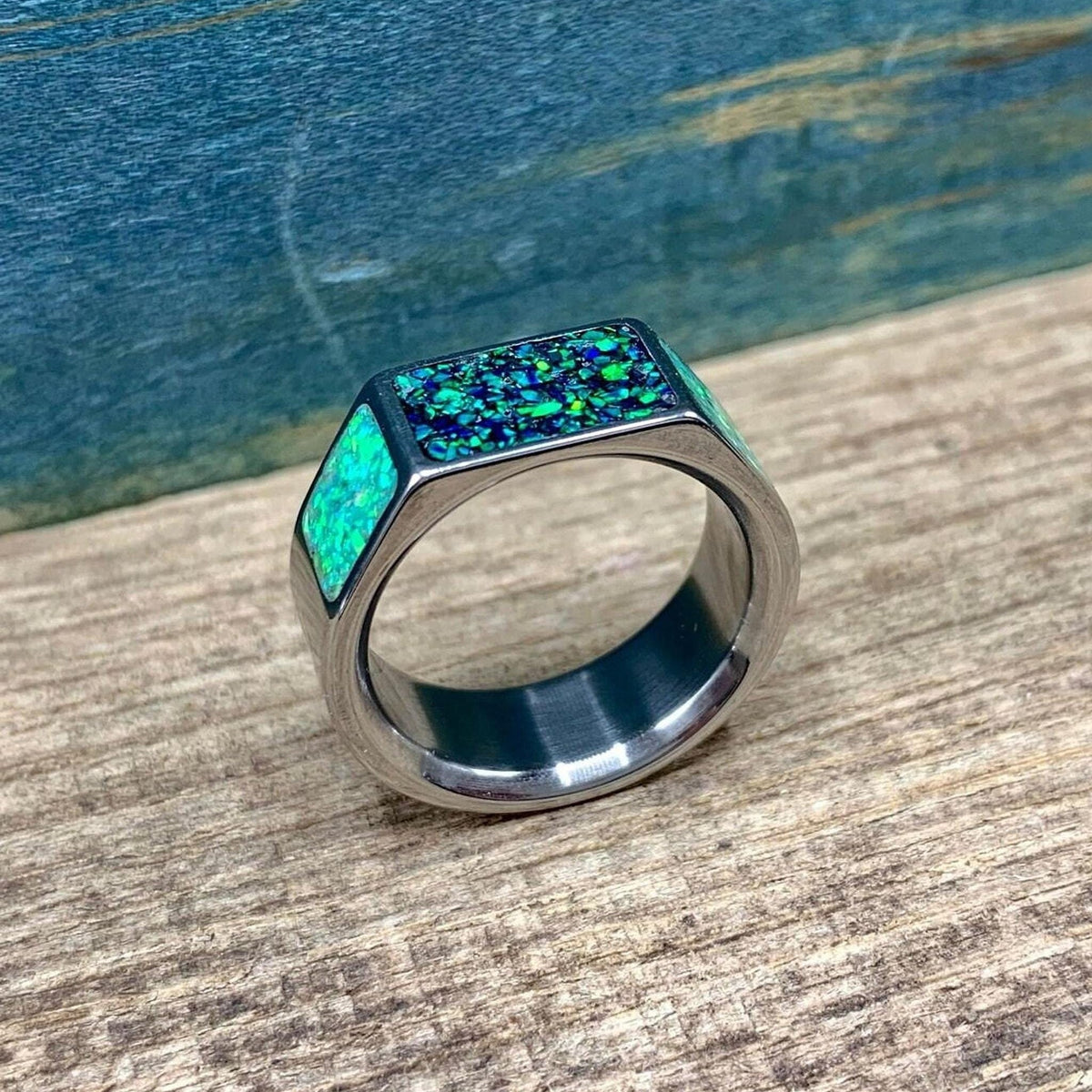 Men's green opal signet style wedding band in titanium, featuring a bold design from RobandLean's rings collection.