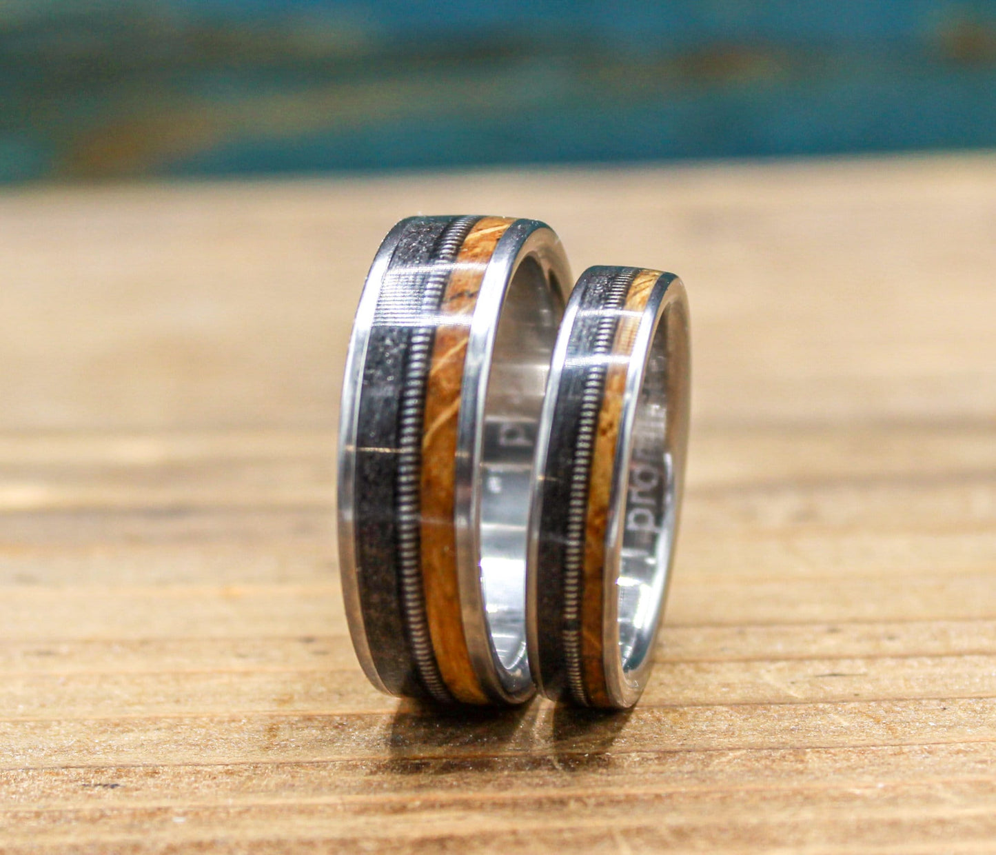 Gunslinger His and Hers Wedding Band Set - Titanium Couples Rings with Whiskey Barrel Wood and Guitar String Inlays