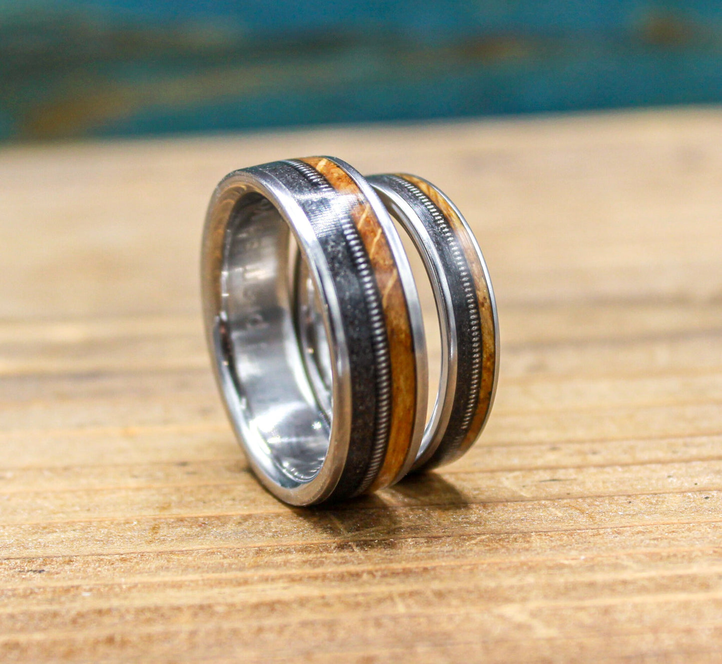 Gunslinger His and Hers Wedding Band Set - Titanium Couples Rings with Whiskey Barrel Wood and Guitar String Inlays