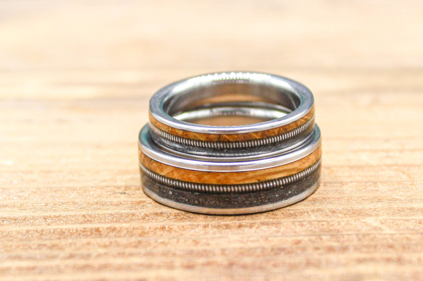 Gunslinger His and Hers Wedding Band Set - Titanium Couples Rings with Whiskey Barrel Wood and Guitar String Inlays