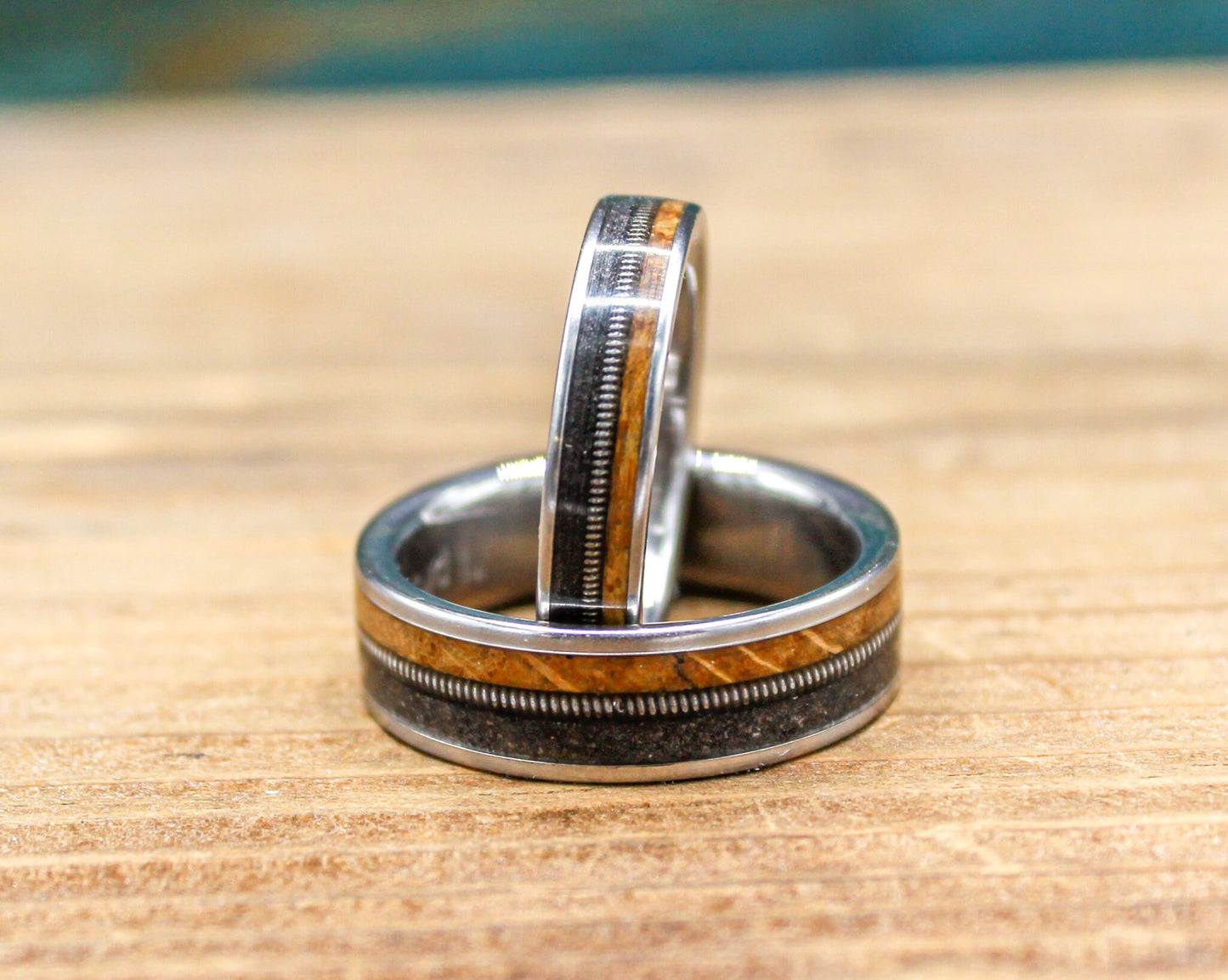 Gunslinger His and Hers Wedding Band Set - Titanium Couples Rings with Whiskey Barrel Wood and Guitar String Inlays