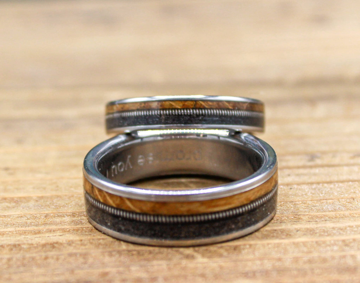 Gunslinger His and Hers Wedding Band Set - Titanium Couples Rings with Whiskey Barrel Wood and Guitar String Inlays