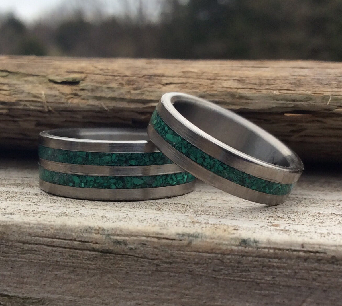 His and hers matching titanium couples rings with malachite in a unique wedding bands set by RobandLean.