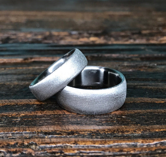 Luster finish titanium wedding band set by RobandLean's rings, featuring sleek, polished silver rings for couples.