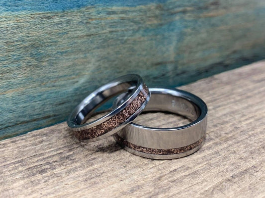 Elegant titanium rose gold wedding bands set by RobandLean's rings, featuring matching his and hers design with a smooth finish.