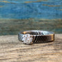 Ladies Moissanite Damascus Steel Engagement Ring with intricate pattern and sparkling stone from RobandLean's rings collection.