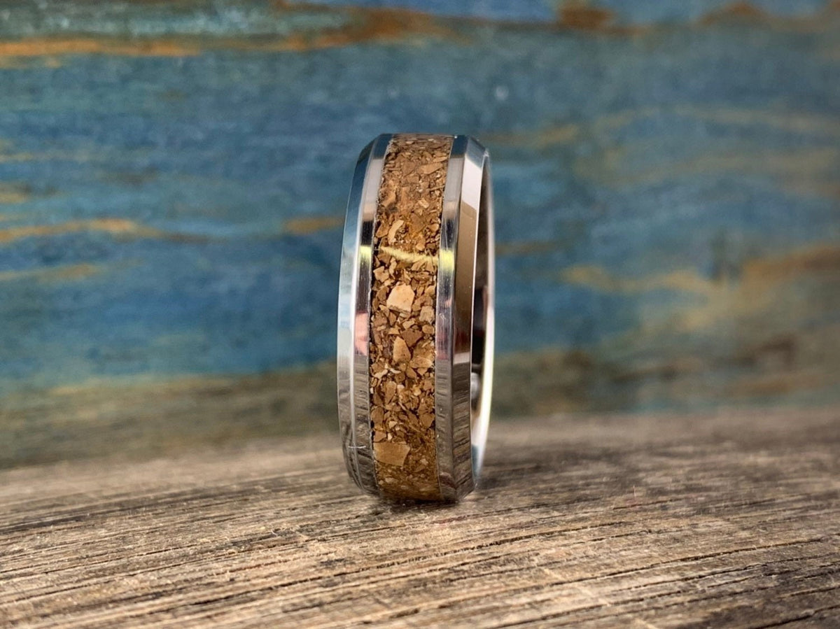 Men's tungsten ring with T-Rex dinosaur bone inlay, RobandLean's men's wedding band featuring a striking dinosaur bone design.