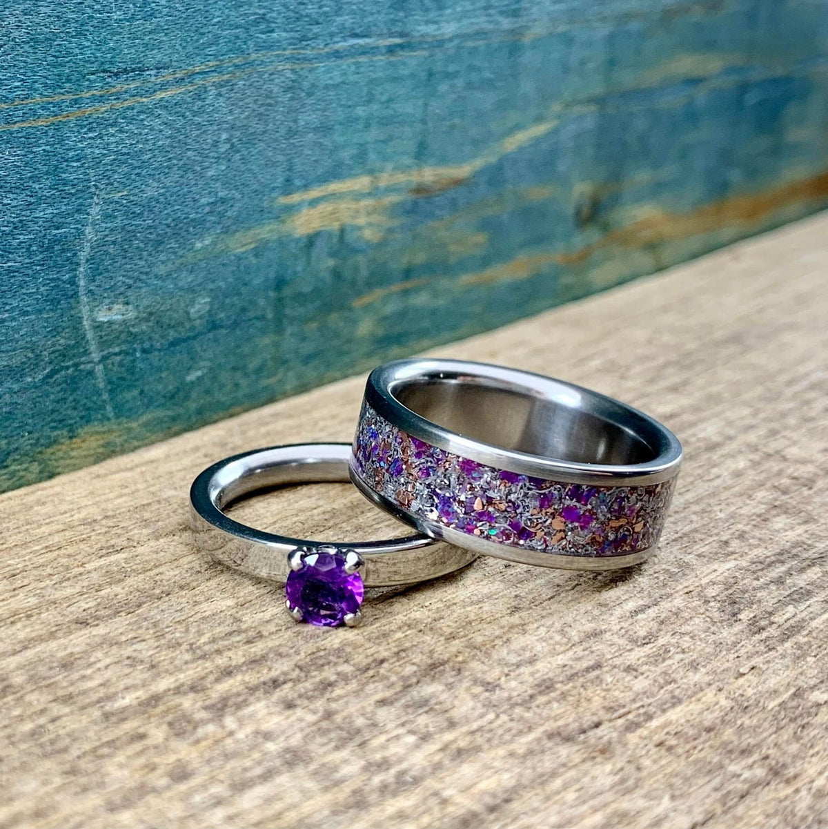 RobandLean's wedding band set featuring his and hers amethyst and meteorite engagement rings, showcasing detailed designs and craftsmanship.